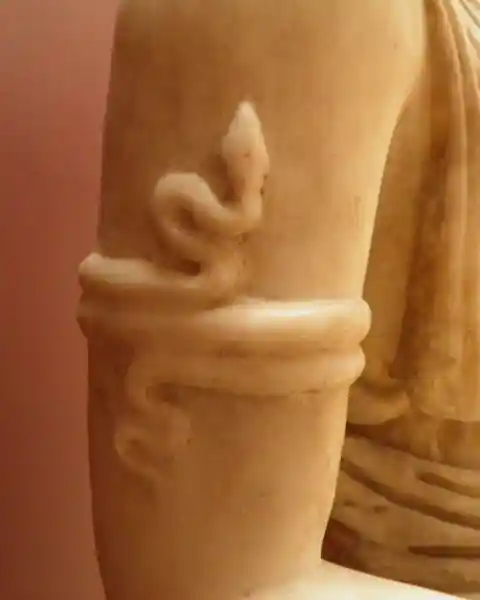 Snake on the arm of Artemis. Statue of Artemis
